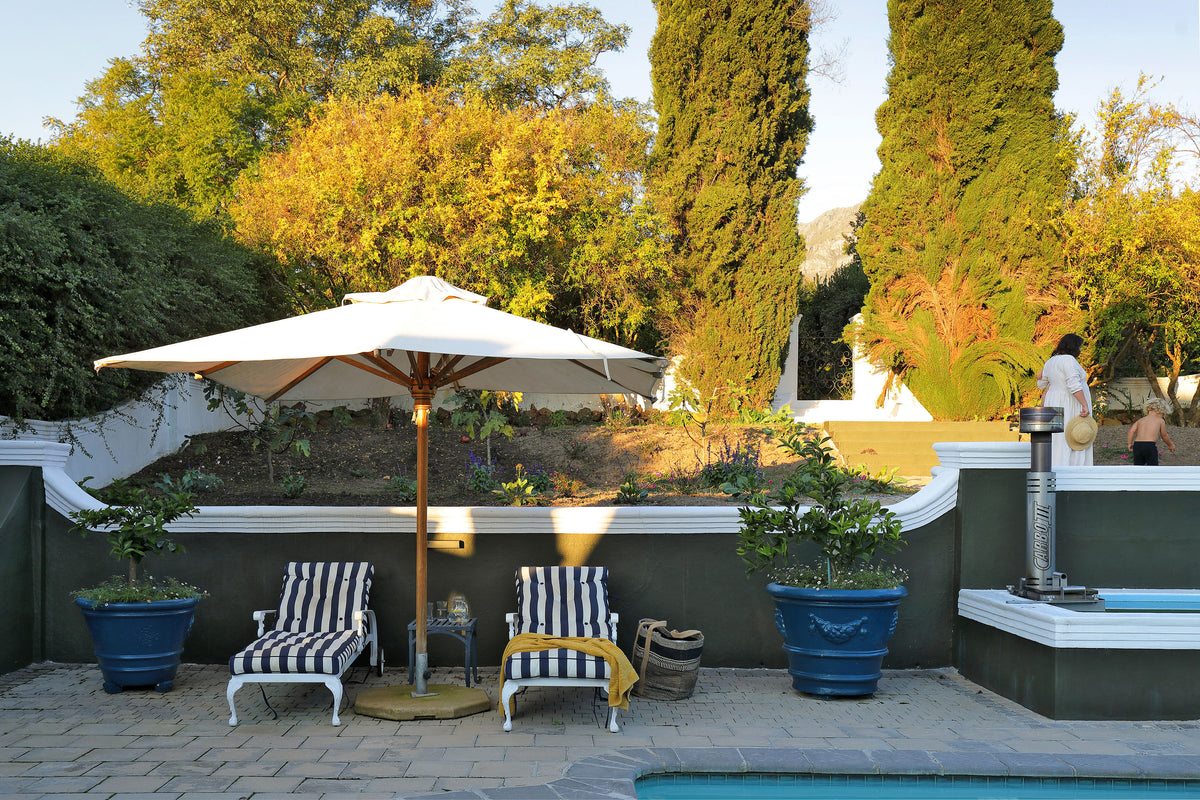 Private pool with loungers at The Manor House