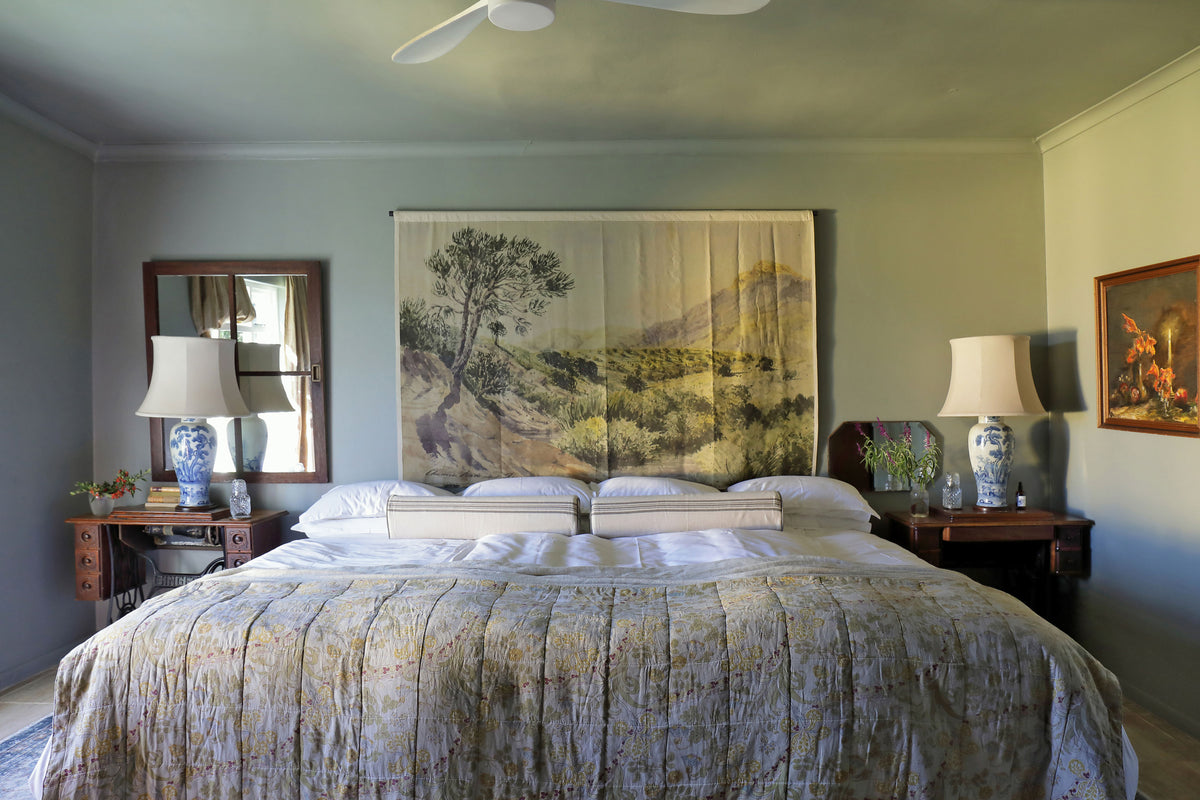 King-size bedroom overlooking the paddocks at Olive Cottage