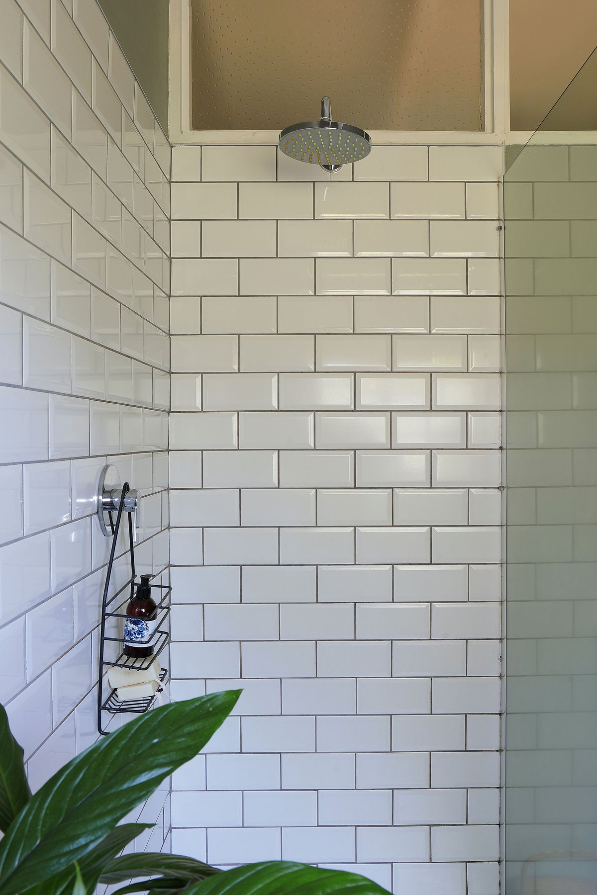 En-suite bathroom with bath and shower at Vineyard Quarters