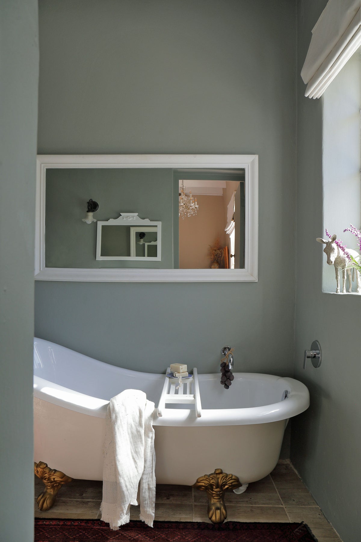 En-suite bathroom with bath and shower at Vineyard Quarters