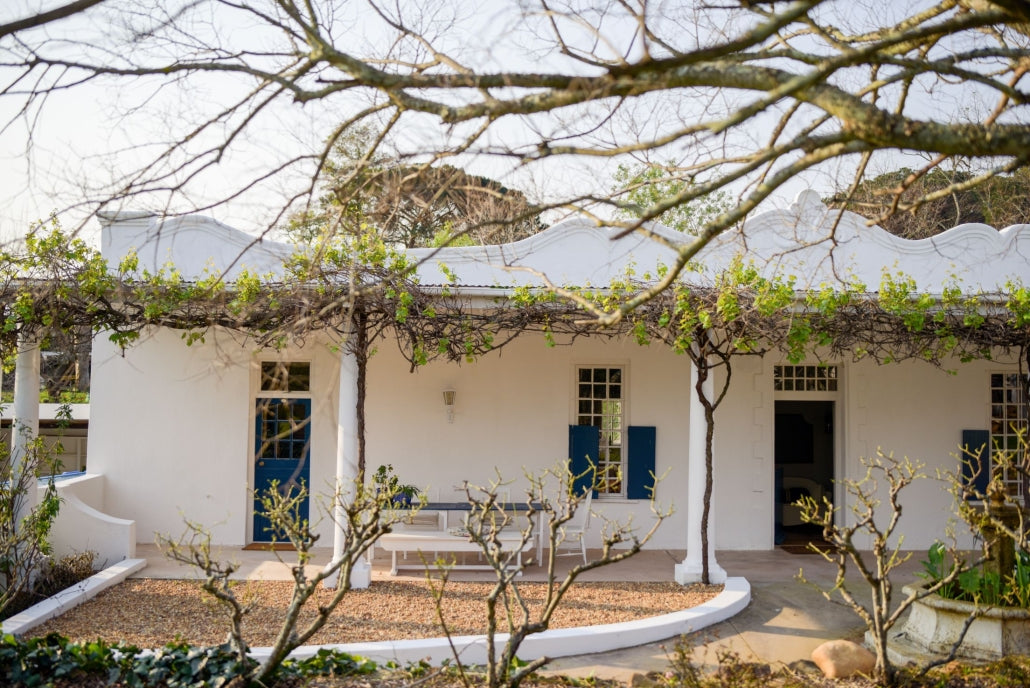 Exterior of Vineyard Family Suite beside the rose garden at San Gabriel Homestead