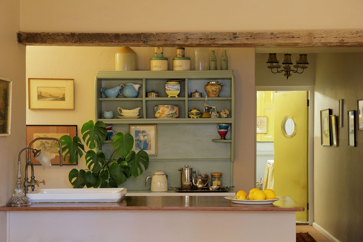 Compact kitchen and dining area inside Willow Suite